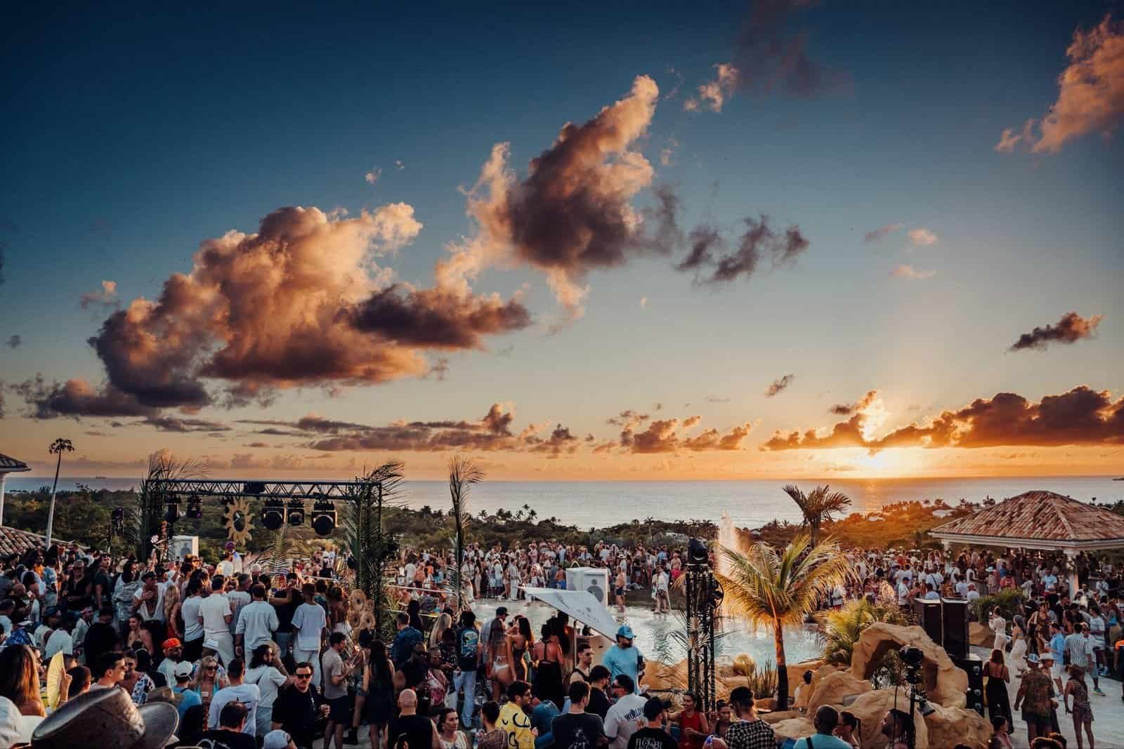 Crowd at the villa party during SXM Festival 2026 at sunset on Saint Martin