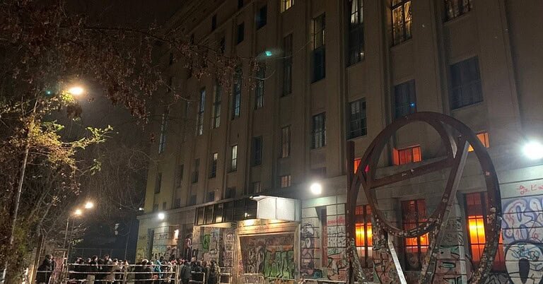 Berghain nightclub facade and entrance queue at night in Berlin