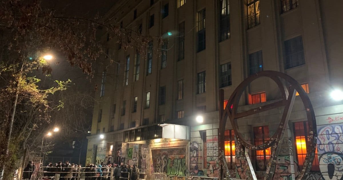 Berghain nightclub facade and entrance queue at night in Berlin