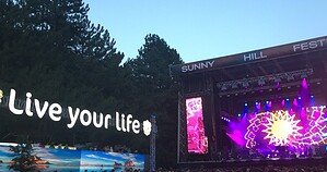Sunny Hill Festival main stage lit up at dusk in Prishtina, Kosovo