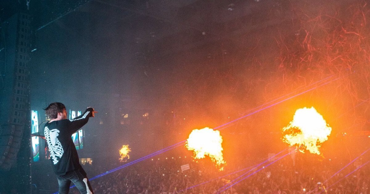 Controlled flame jets fire from a festival Mainstage as a DJ performs, illustrating Tomorrowland 2026 weekend two pyrotechnics Controlled flame jets fire from a festival Mainstage as a DJ performs, illustrating Tomorrowland 2026 weekend two pyrotechnics