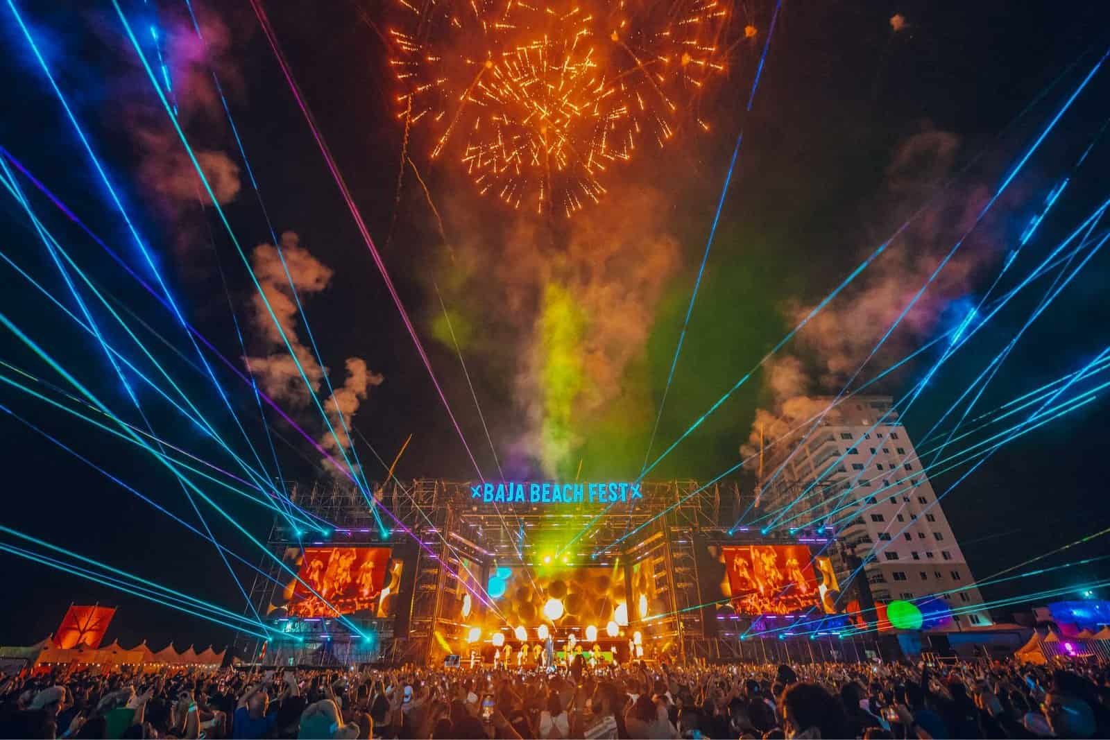 Baja Beach Fest main stage lit by fireworks and lasers above the crowd in Rosarito, Mexico Baja Beach Fest main stage lit by fireworks and lasers above the crowd in Rosarito, Mexico