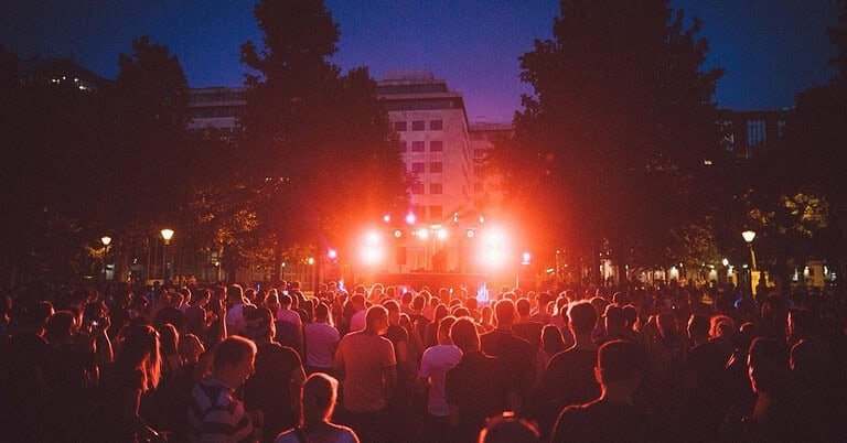 Crowd at an open air techno festival at night, autumn techno festivals Europe 2026