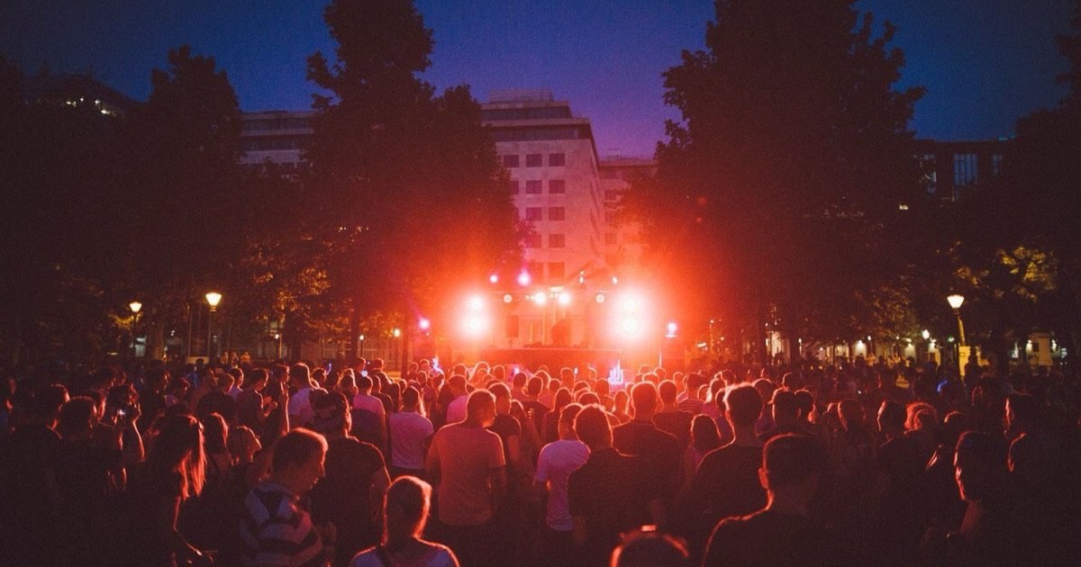 Crowd at an open air techno festival at night, autumn techno festivals Europe 2026 Crowd at an open air techno festival at night, autumn techno festivals Europe 2026