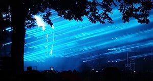 Charlotte de Witte open-air techno set with blue lasers, echoing her New York B2B with Yousuke Yukimatsu