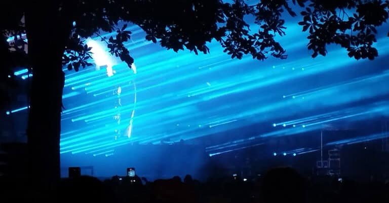 Charlotte de Witte open-air techno set with blue lasers, echoing her New York B2B with Yousuke Yukimatsu