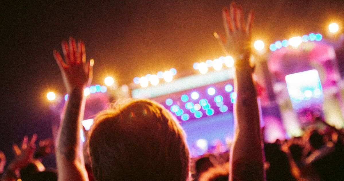 Crowd with hands raised at a night-time festival main stage, illustrating Creamfields 2026 at Daresbury Crowd with hands raised at a night-time festival main stage, illustrating Creamfields 2026 at Daresbury