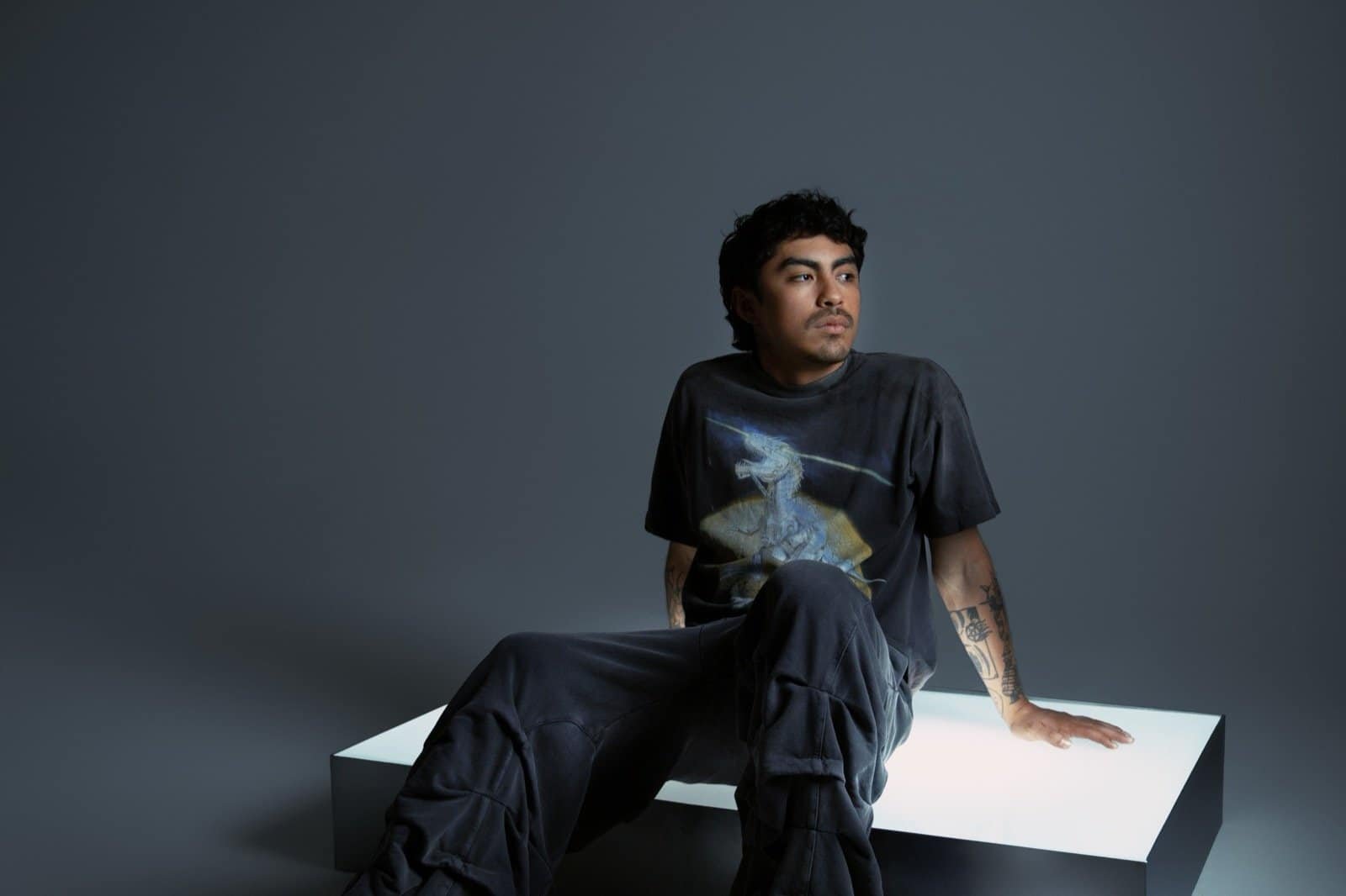 Funk Tribu seated in a studio, 2026 press shoot Funk Tribu seated in a studio, 2026 press shoot