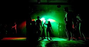 Silhouetted crowd on a dark club dancefloor, illustrating the hard techno scene accountability debate in 2026 Silhouetted crowd on a dark club dancefloor, illustrating the hard techno scene accountability debate in 2026