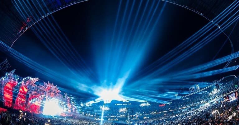Crowd and light beams at the UNTOLD 2026 main stage in Cluj-Napoca, host of Europe's first on-site festival breast cancer screening