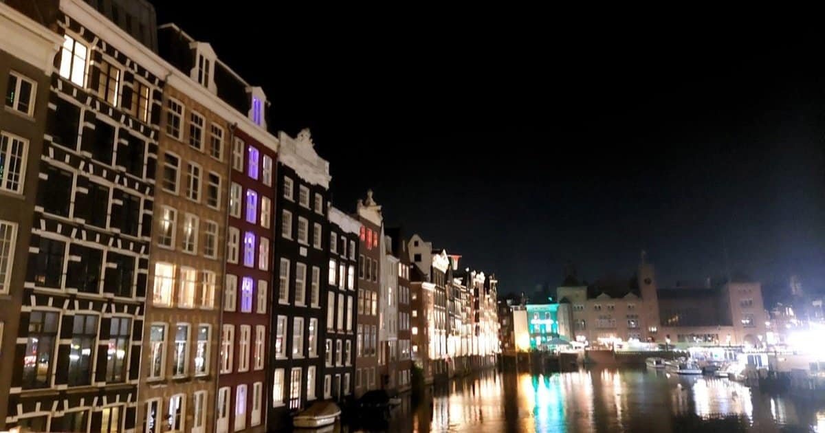 Amsterdam canal houses lit at night, host city of Amsterdam Dance Event 2026 Amsterdam canal houses lit at night, host city of Amsterdam Dance Event 2026