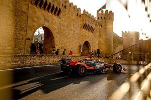 Formula 1 car passing the Old City walls on the Baku City Circuit during the Azerbaijan Grand Prix Formula 1 car passing the Old City walls on the Baku City Circuit during the Azerbaijan Grand Prix