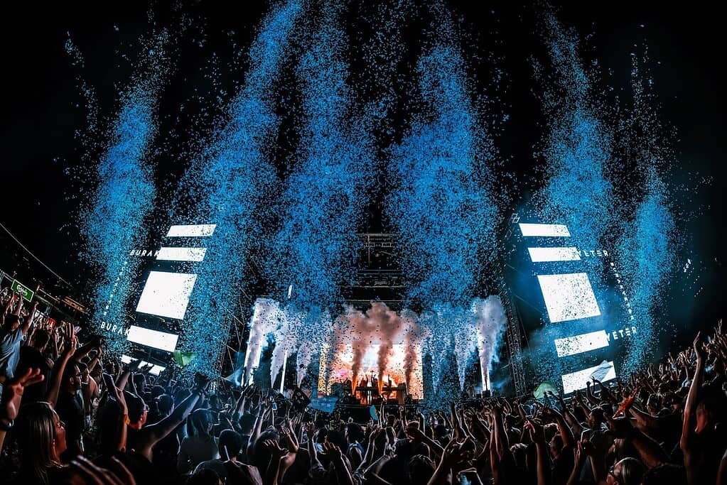 Main stage and crowd under blue confetti at EXIT to Montenegro in 2026