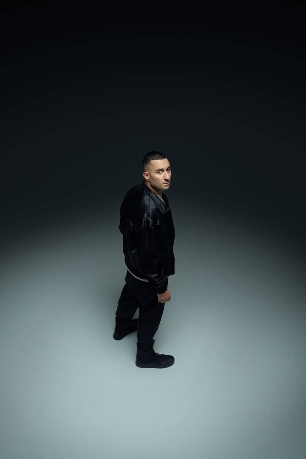 Joseph Capriati and GENNARO Team Up on 'Control' for Metamorfosi Records 2 Joseph Capriati press photo against a red backdrop with a band of light