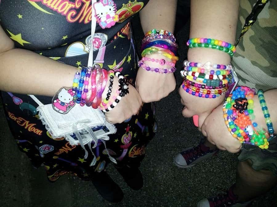Rave Bae, Rail Rider, Kandi: A Rave Slang Dictionary for 2026 1 Stacked kandi bracelets on ravers wrists, a core piece of rave slang and rave culture