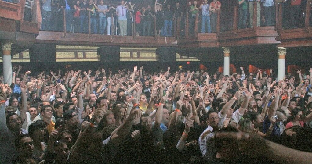 Rave crowd with hands raised, illustrating a rave slang dictionary Rave crowd with hands raised, illustrating a rave slang dictionary