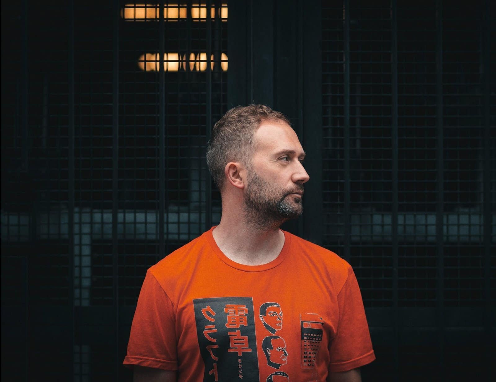 Scarper Opens His Archive With Off-Cuts (2014-2021) on Plexus Records 2 Scarper in an orange t-shirt, press photo for Off-Cuts (2014-2021)