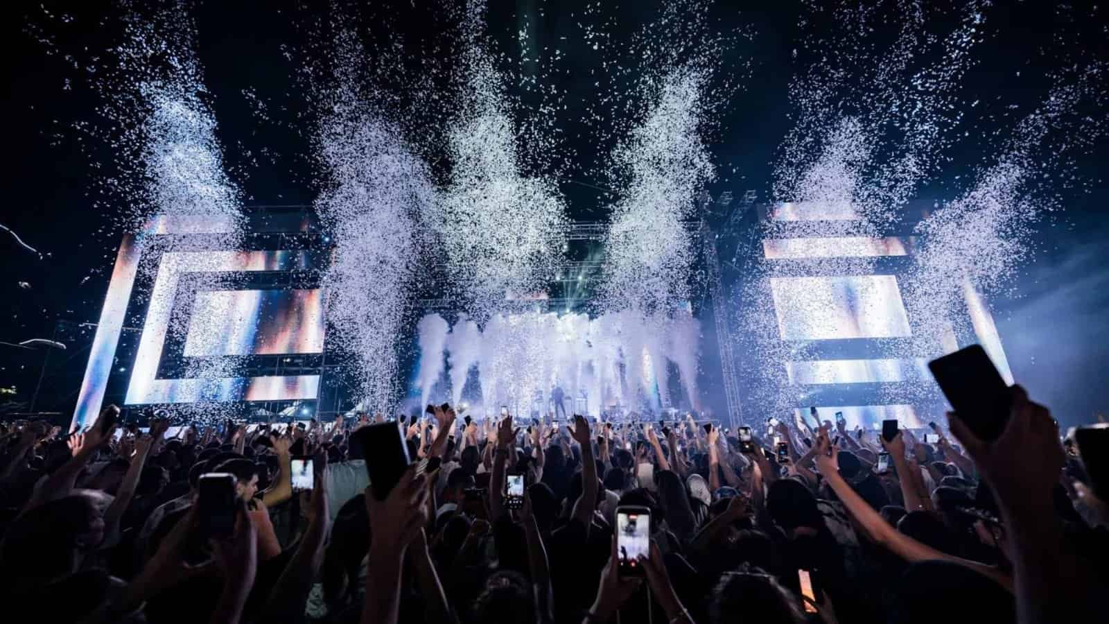 Sea Dance Festival 2026 Main Stage on Bečići Beach, Budva Crowd raising phones as confetti cannons fire over the Sea Dance Main Stage on Bečići Beach, Budva