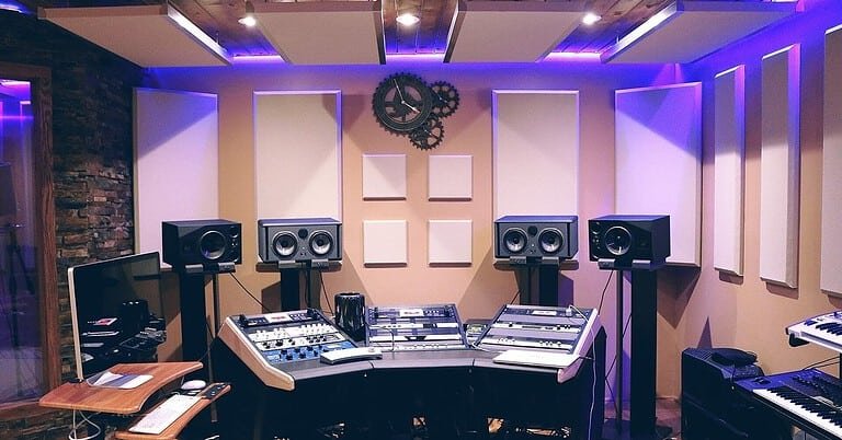 Music production studio with DAW workstation, monitors and synths, where AI tools for music production are used
