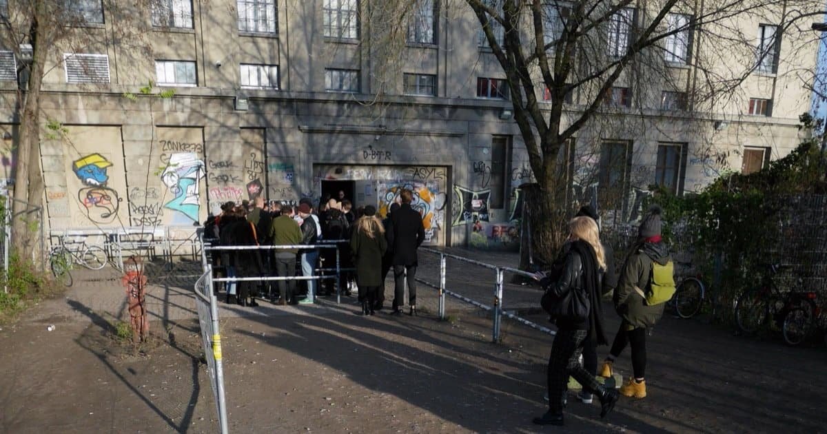 People queueing at the Berghain door in Berlin, how to get into Berghain 2026 People queueing at the Berghain door in Berlin, how to get into Berghain 2026