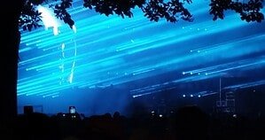 Blue lasers over the crowd at a Charlotte de Witte show, ahead of Top 100 DJs LIVE 2026 at [UNVRS] Ibiza