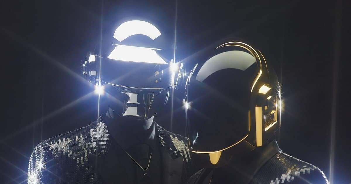 Daft Punk in their silver and gold helmets and sequin jackets, Random Access Memories press photo, 2013 Daft Punk in their silver and gold helmets and sequin jackets, Random Access Memories press photo, 2013