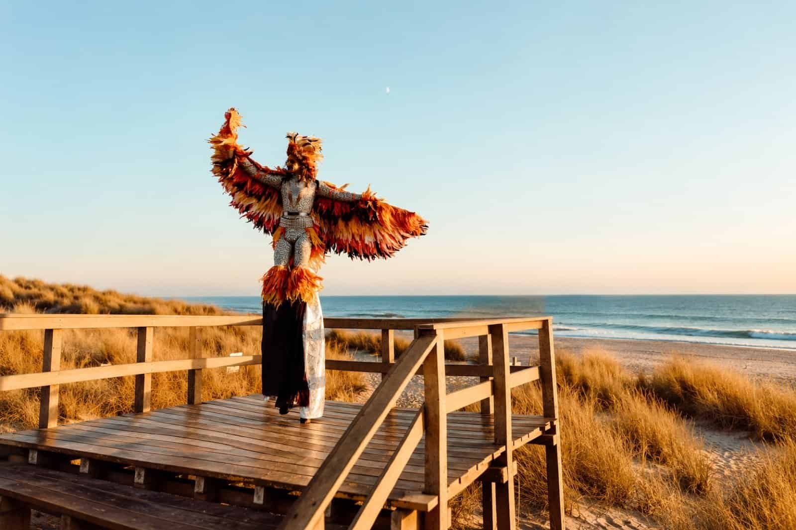 DHB Portugal 2026 in Photos: 10 Moments From Costa da Caparica 5 Stilt performer on the dunes at DHB Portugal 2026