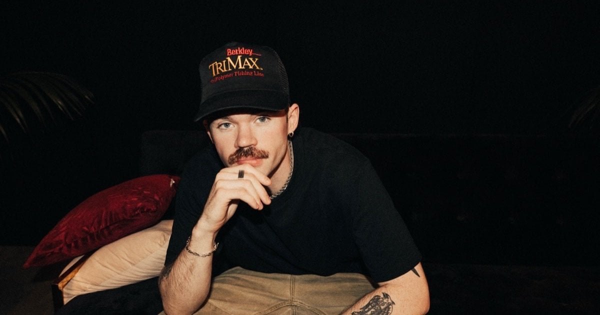 Dom Dolla, Australian tech house DJ and founder of Good Fortune Records, portrait in a black cap