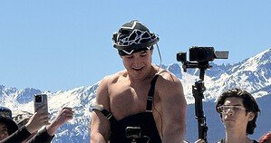 John Summit, 32, DJing outdoors at Vail ski resort in March 2026 with snowy mountains behind him