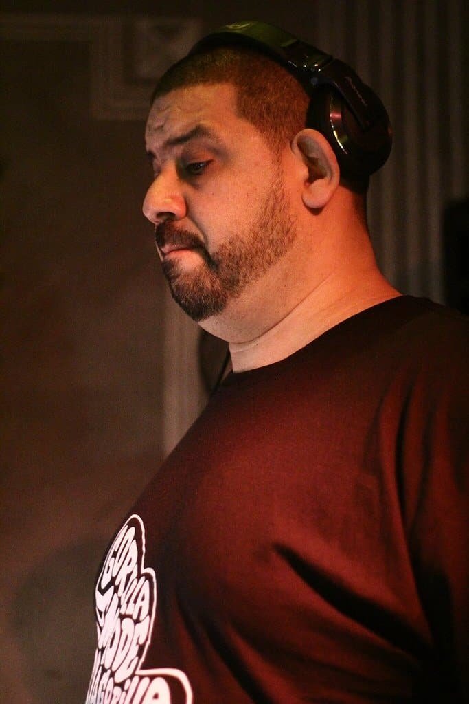 Techno Curiosities: 10 Questions Fans Always Ask About Their Favourite DJs 10 Kenny Dope DJing with headphones on one ear at Djoon, Paris