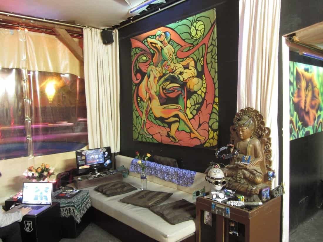 Photos & Videos From Inside KitKatClub: Berlin's Most Infamous Club 3 KitKatClub Berlin pool seen through plastic curtains next to a lounge with a large painting and a Buddha statue