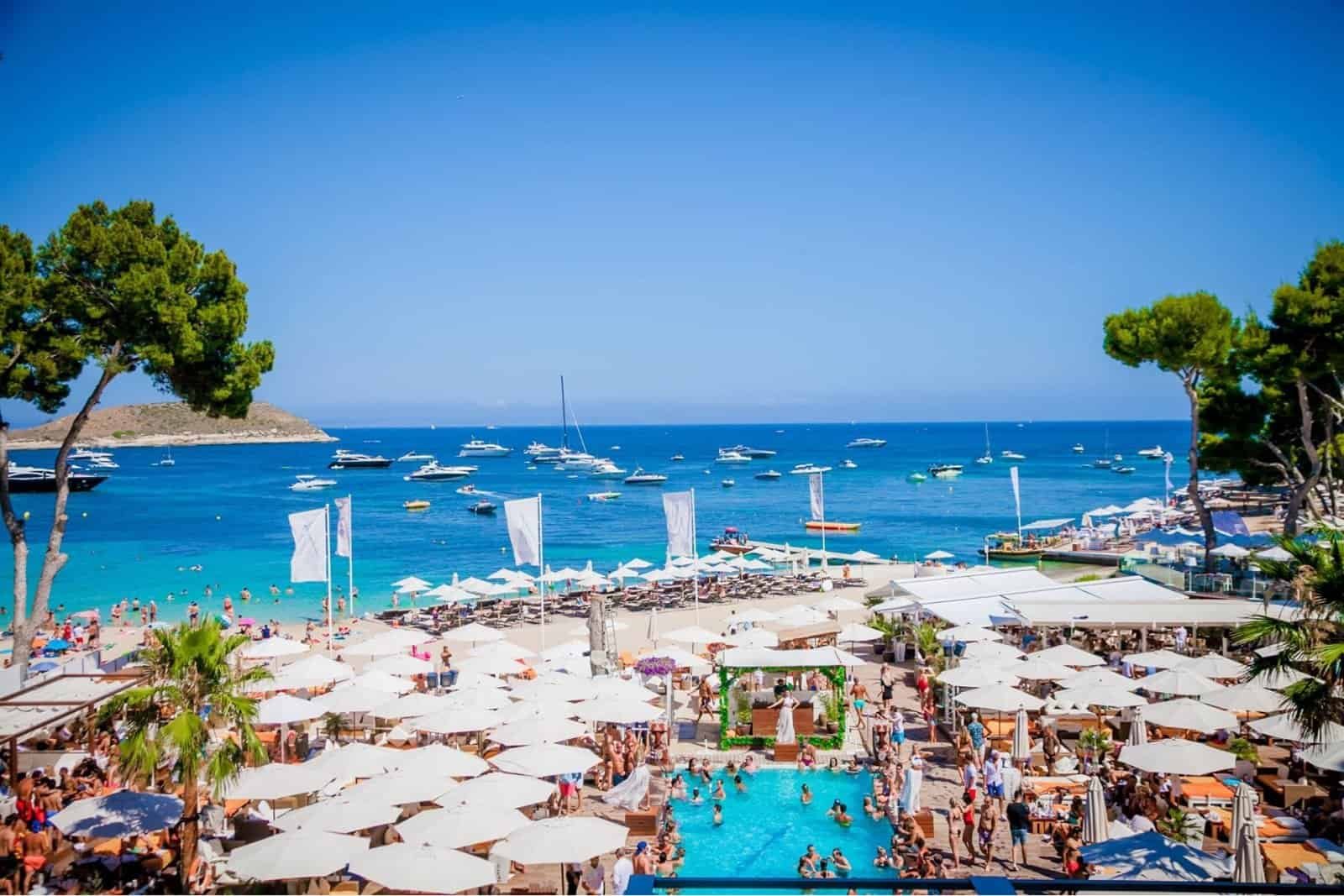 The Best Beach Clubs in Europe for 2027 6 Parasols, pool and anchored boats at Nikki Beach Mallorca on the Spanish coast