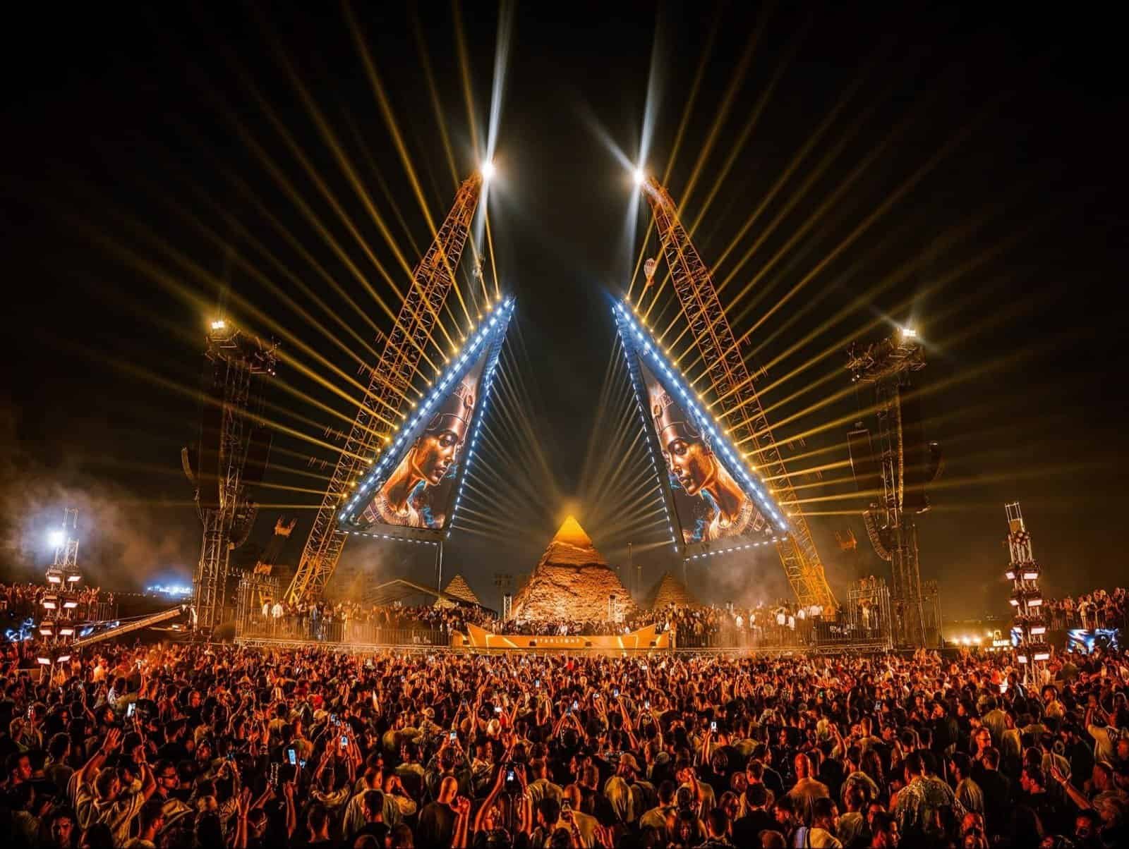 Nine Destination Festivals Worth Travelling For in 2026 and 2027 9 Starlight Festival main stage with lasers in front of the Great Pyramids of Giza at night