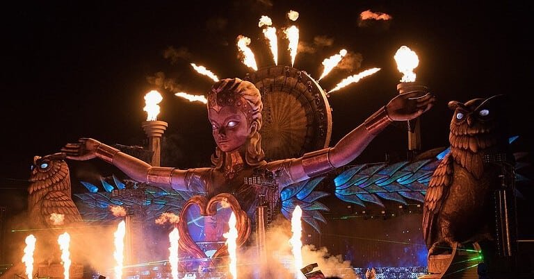 Electric Daisy Carnival main stage with flames and giant owl sculptures, a symbol of the EDM festival boom Electric Daisy Carnival main stage with flames and giant owl sculptures, a symbol of the EDM festival boom